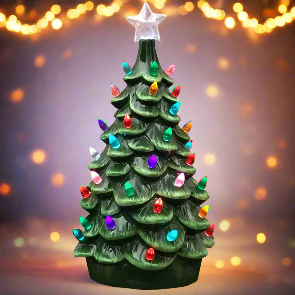 Decorative Christmas tree with colorful lights and a star on a white background
