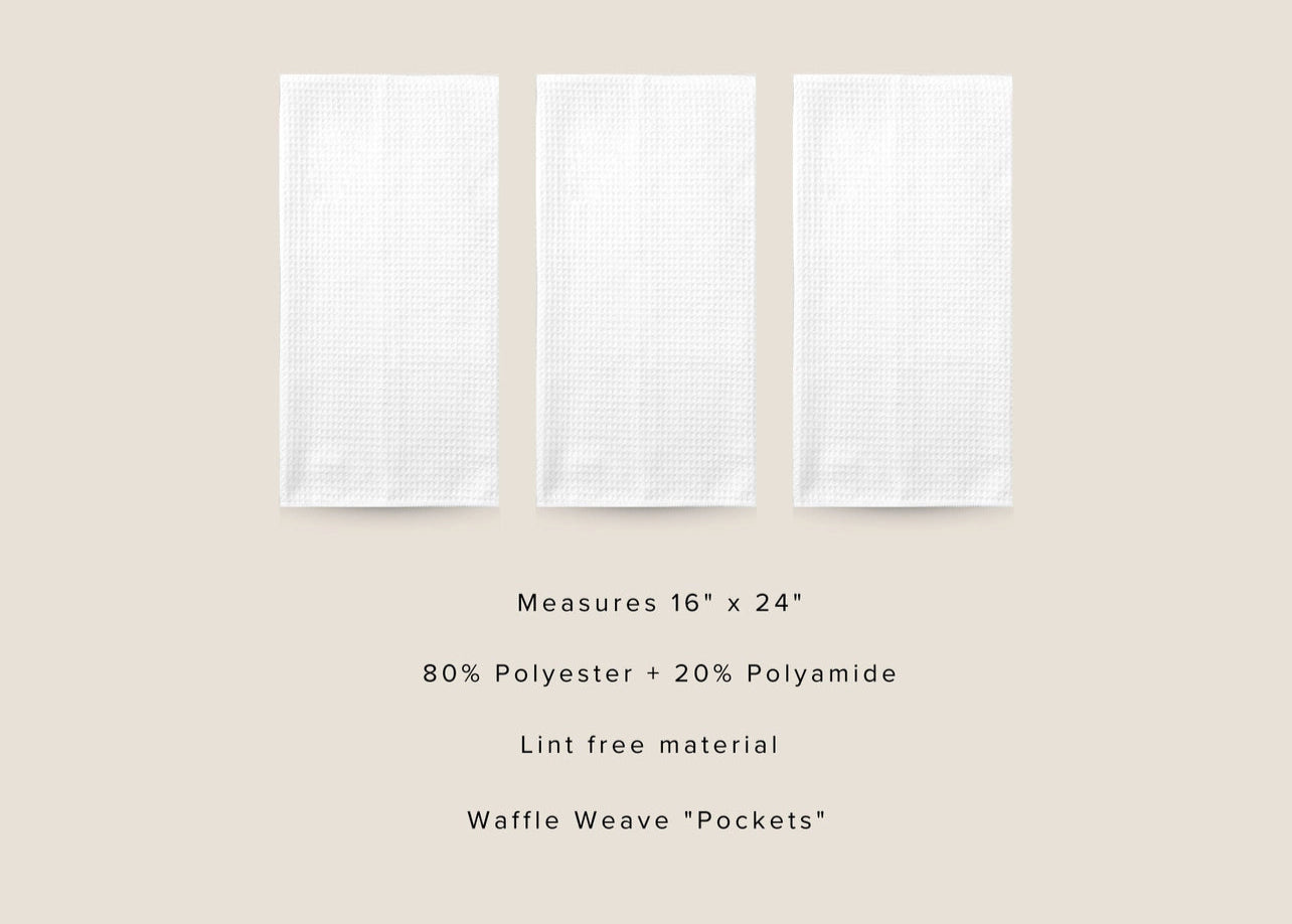 Three white kitchen towels with product details on a beige background