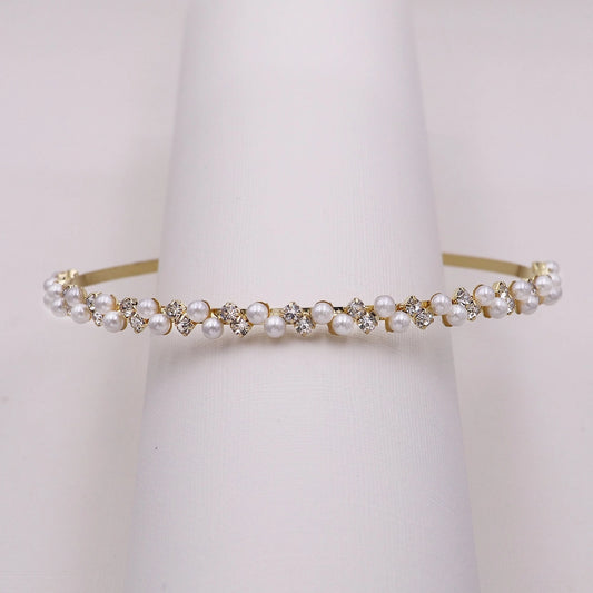 Pearl and crystal headband on a white background