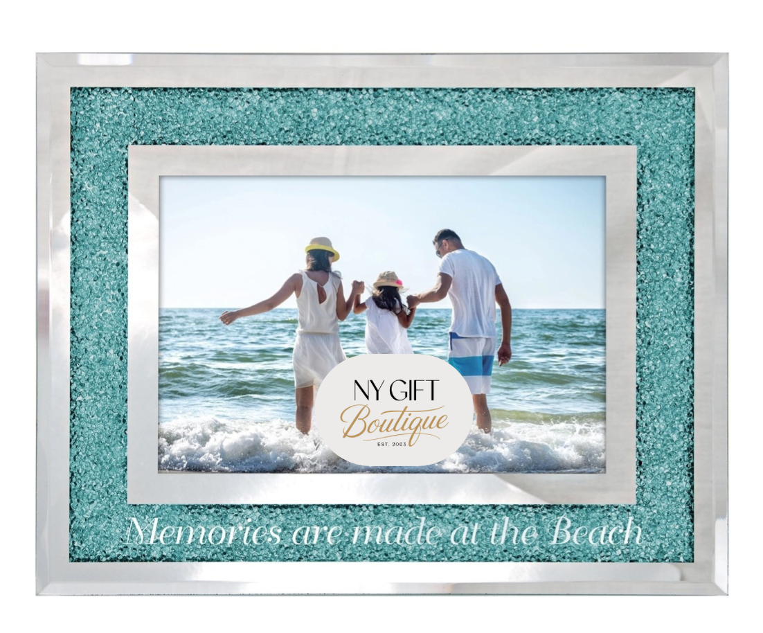 Framed photo of a family at the beach with turquoise glitter border and 'NY Gift Boutique' branding.