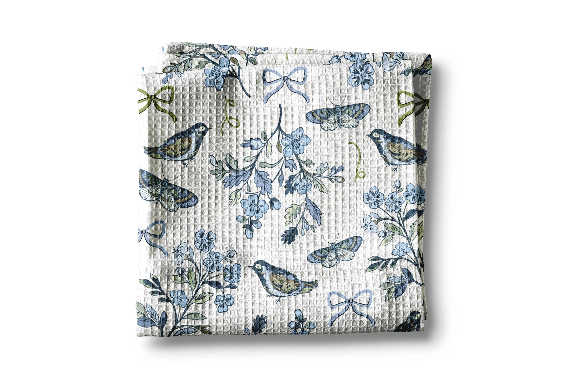 Floral and bird patterned fabric on a white background