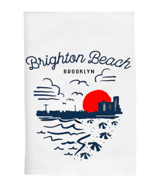 Towel with 'Brighton Beach Brooklyn' design featuring a sunset and cityscape.