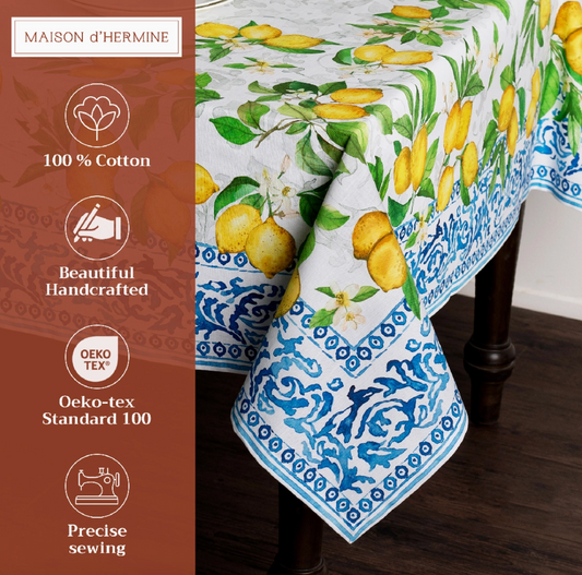 Maison d'Hermine tablecloth with lemon design on a wooden table.