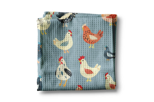 Folded fabric with chicken pattern on a blue background