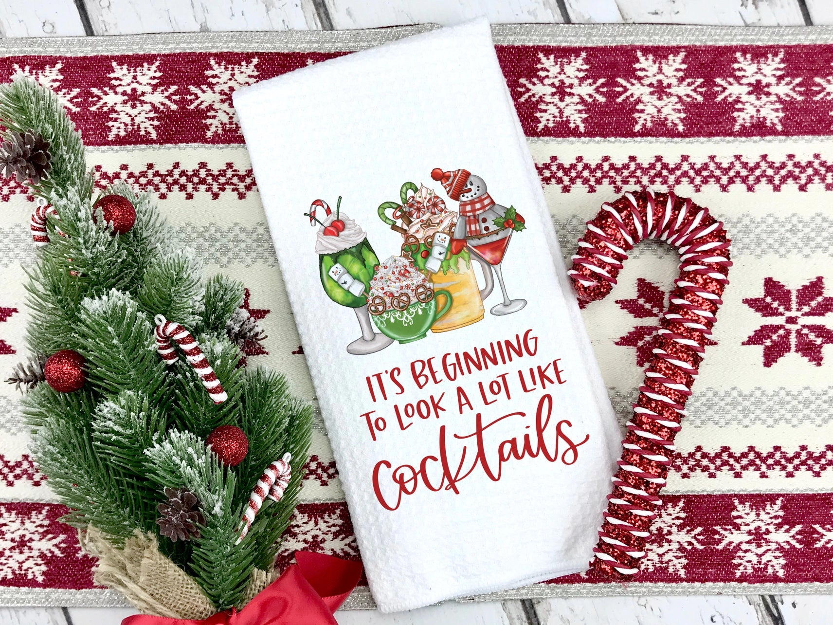Decorative towel with Christmas-themed design and text on a festive background