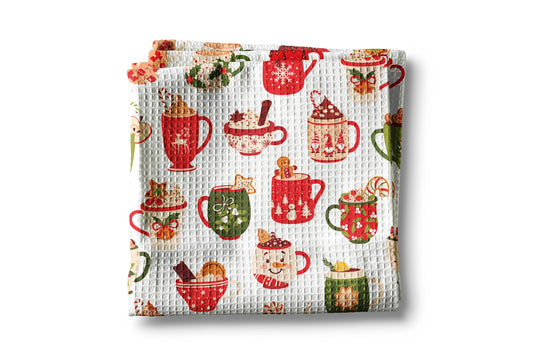 Waffle-textured towel with festive mug pattern on a white background