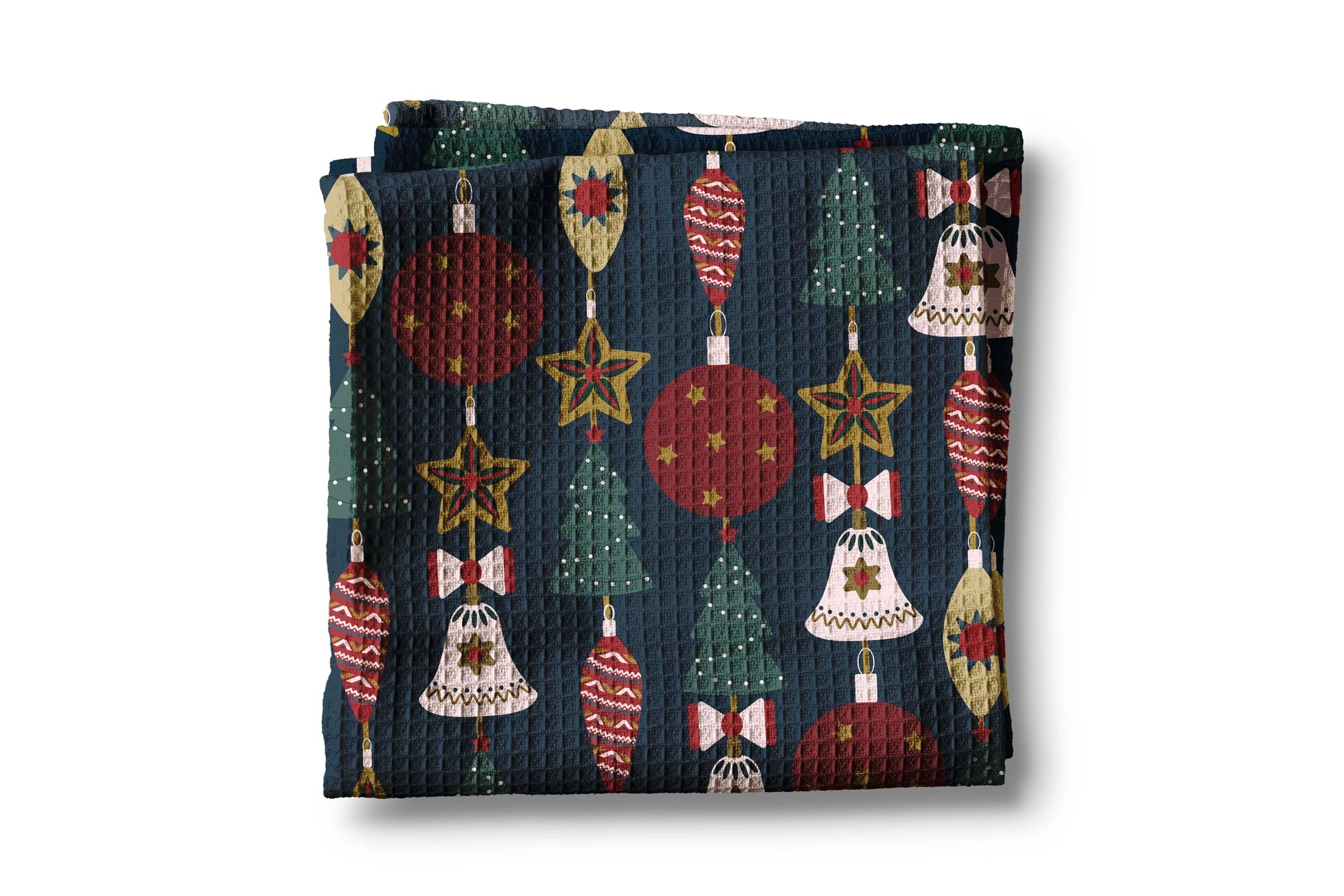 Folded fabric with Christmas-themed pattern on a white background
