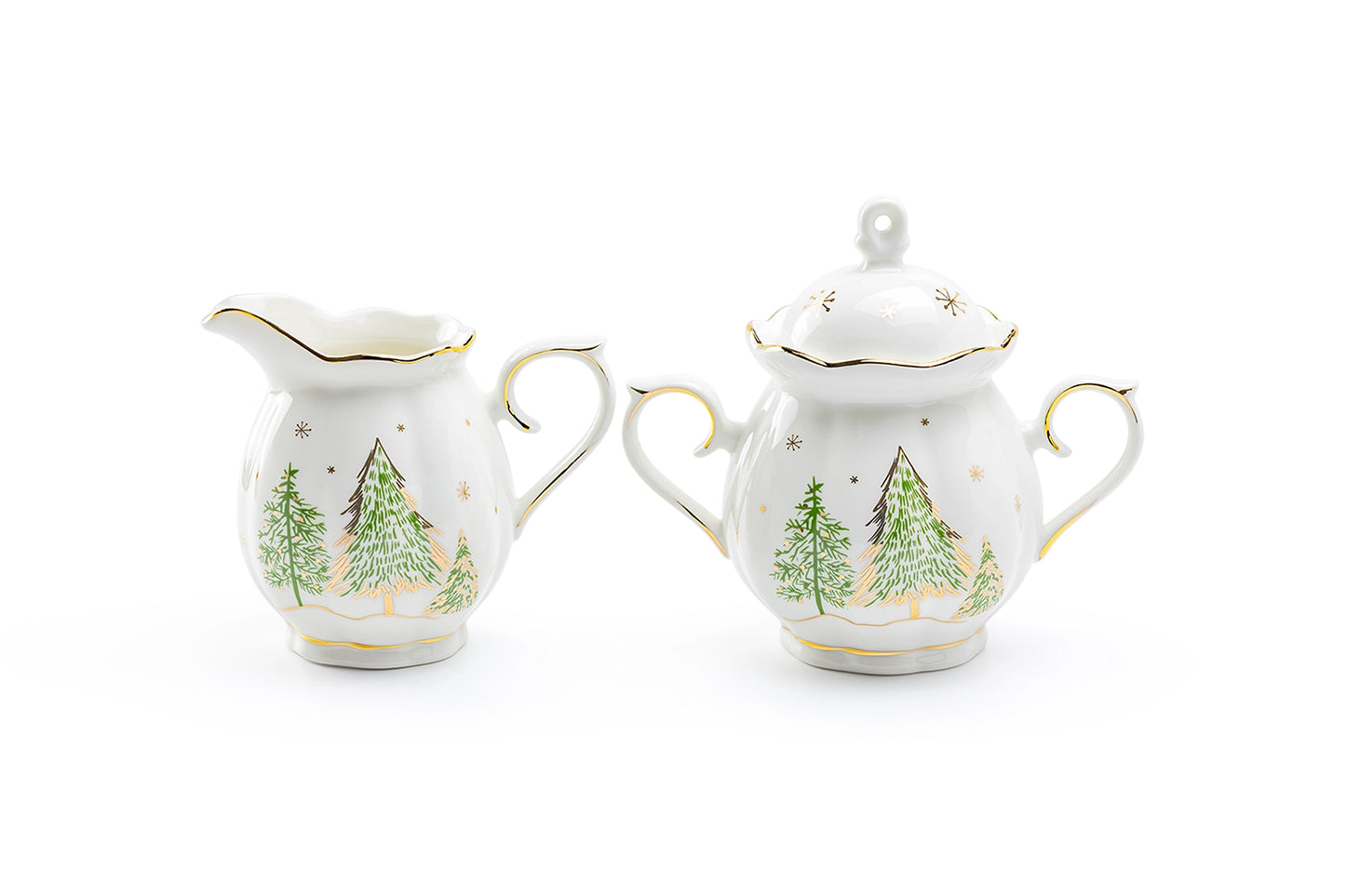 Two ceramic creamer and sugar sets with Christmas tree design on a white background