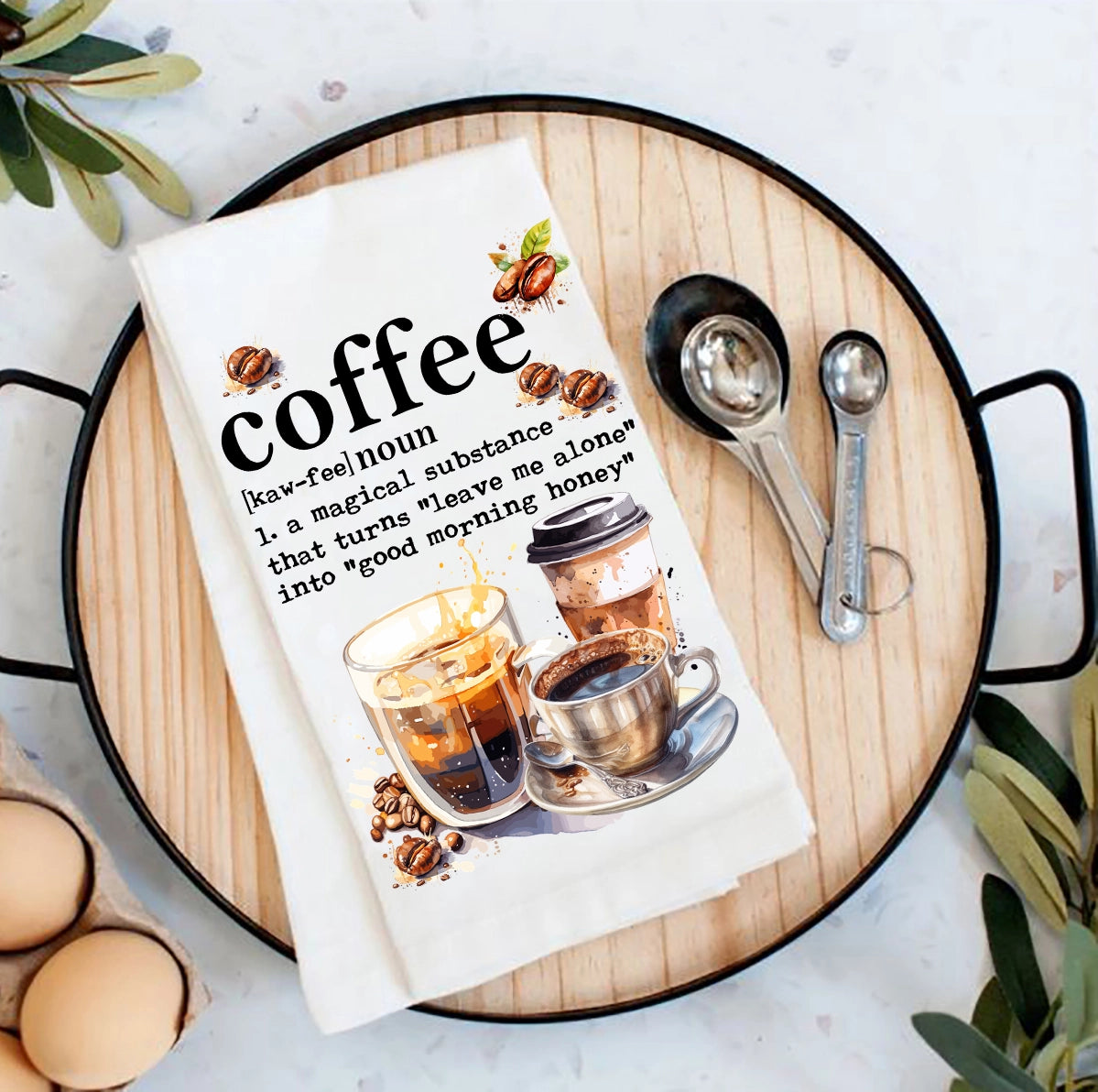 Book titled 'coffee' with coffee-themed illustrations on a wooden tray.