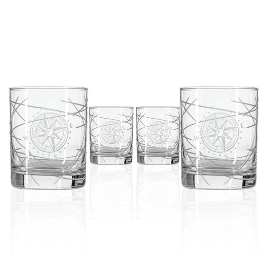 Set of four clear glass tumblers with starfish design on a white background