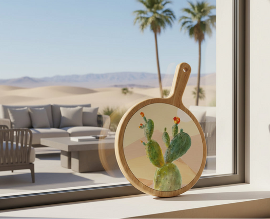 Round cutting board with a cactus design on a white background