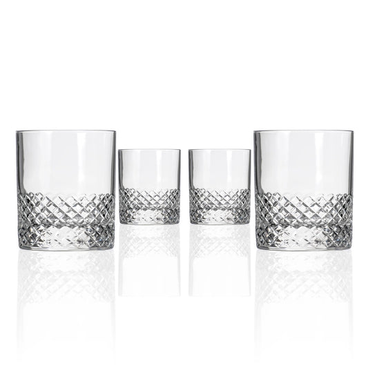 Set of four crystal tumblers with diamond pattern on a white background