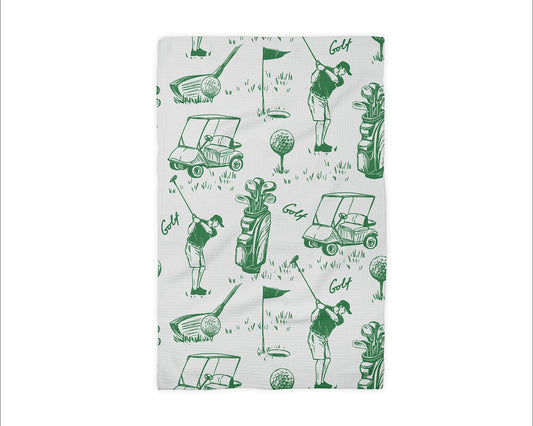 Golf-themed fabric with green graphics on a white background