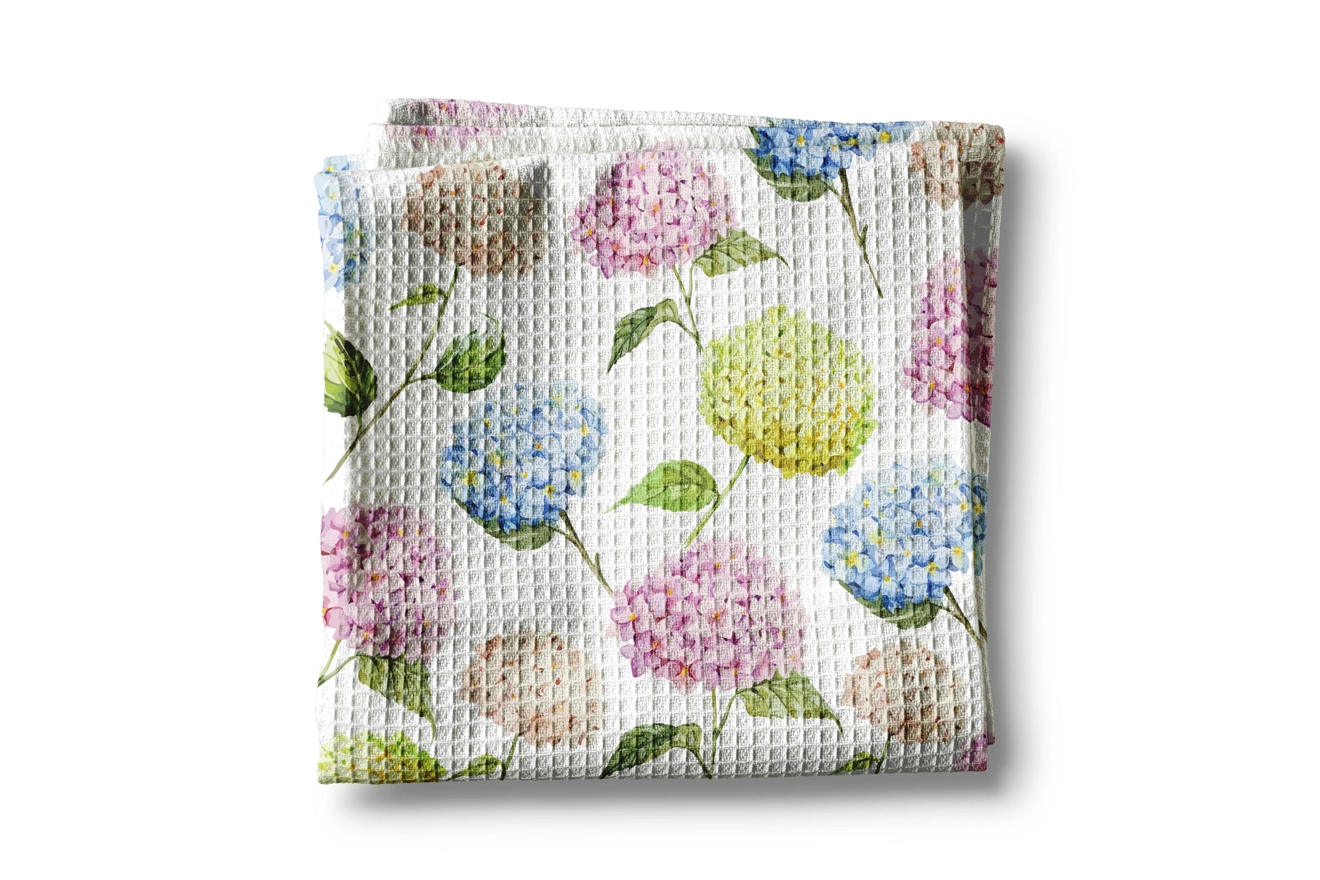 Waffle-textured kitchen towel with floral pattern on a white background