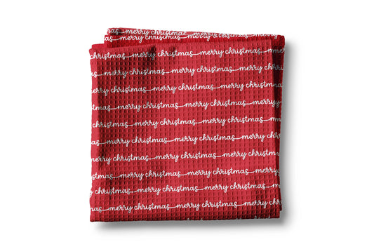 Red towel with 'merry christmas' text on a white background