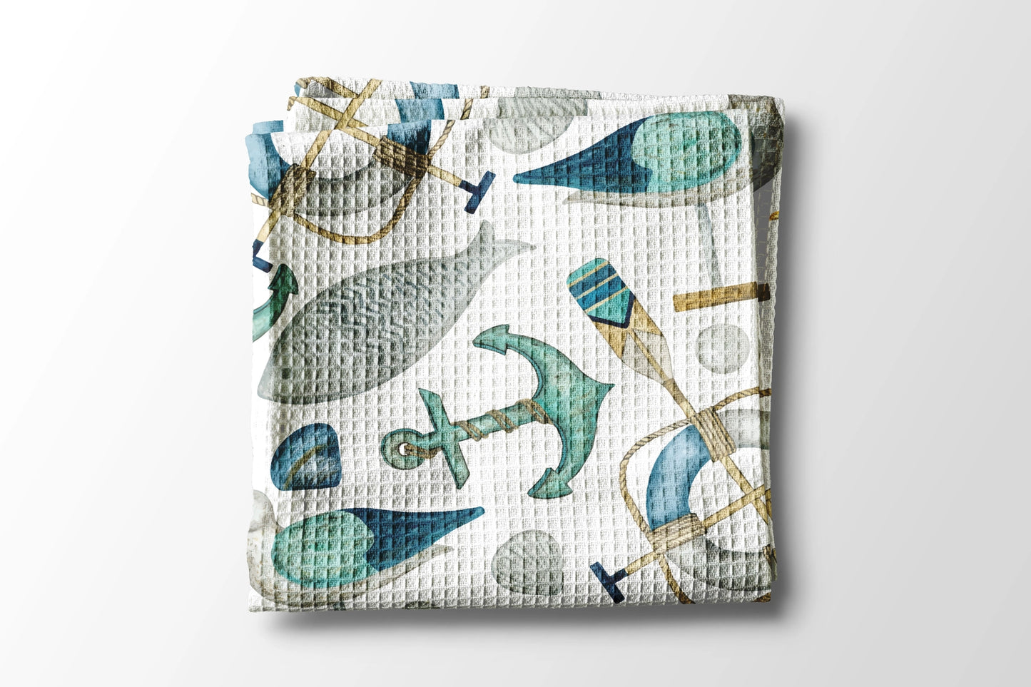 Woven blanket with nautical pattern on a white background