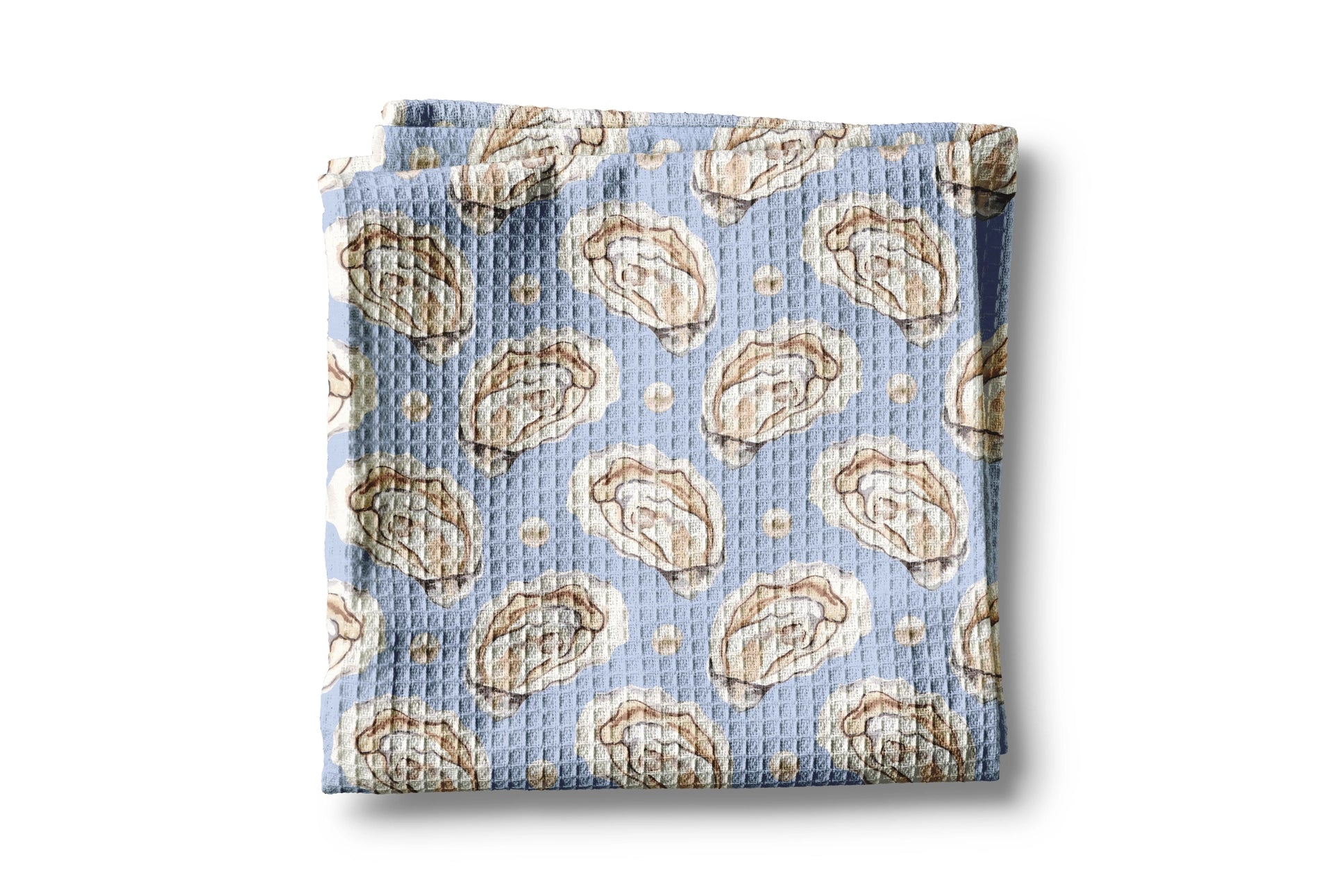 Folded fabric with oyster pattern on a light blue background