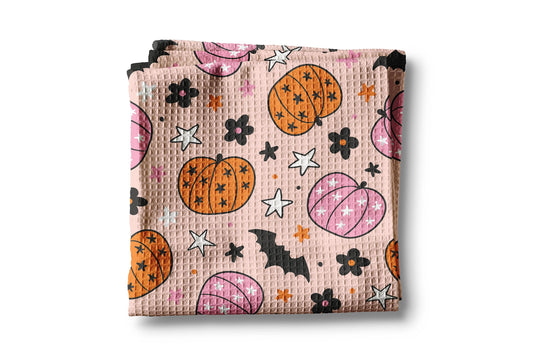 Waffle texture fabric with Halloween-themed pattern on a white background