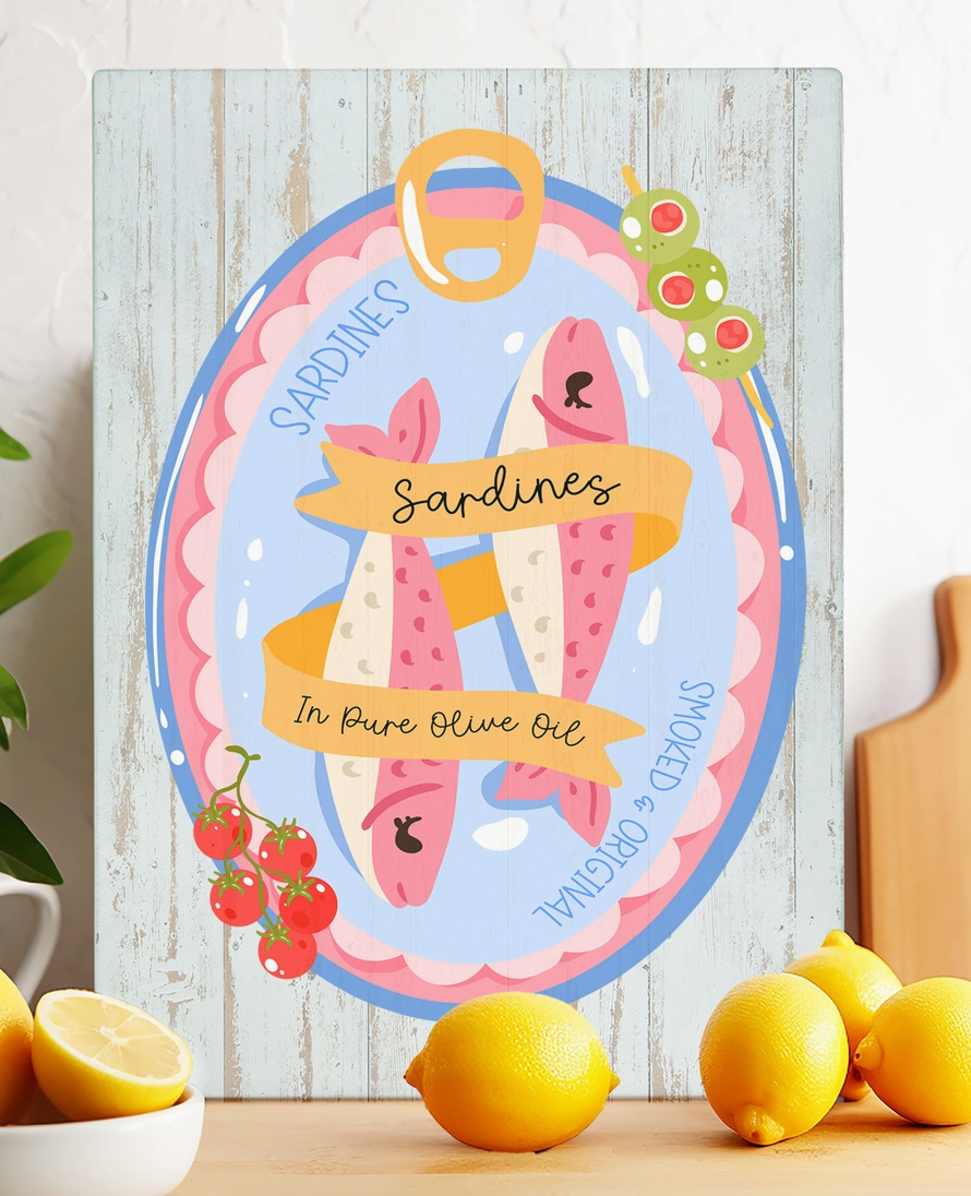 Sardines in olive oil glass trivet with colorful blue and pink fish tin design featuring olives and tomatoes