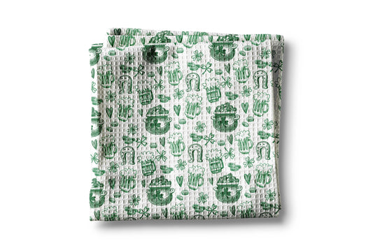 Folded fabric with green pattern on a white background
