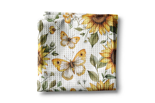 Floral blanket with sunflowers and butterflies on a white background