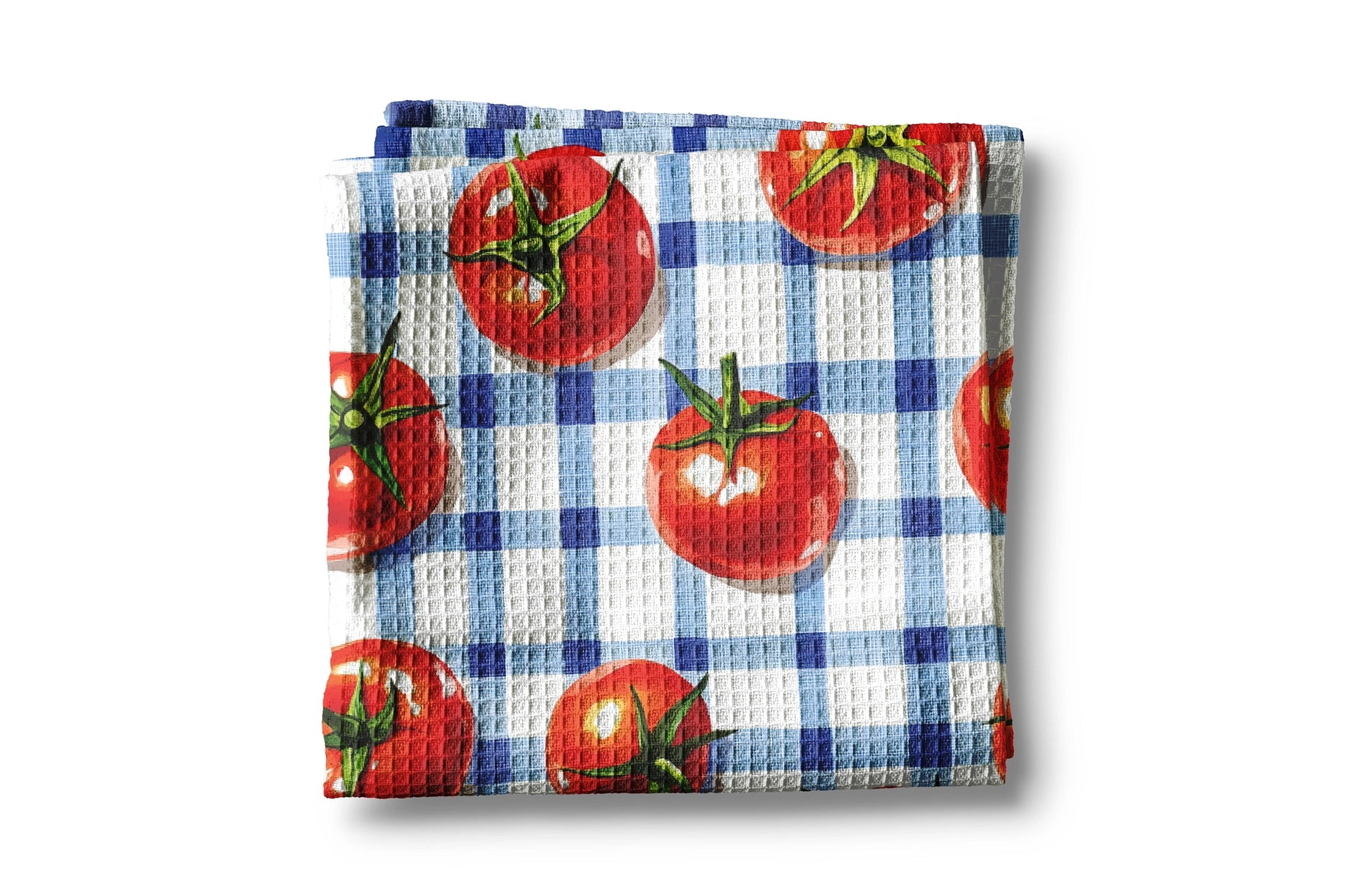Waffle-textured towel with tomato pattern on a white background