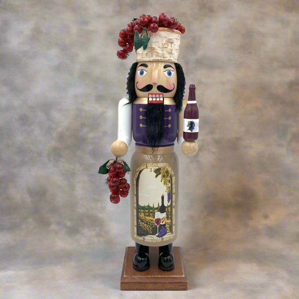Nutcracker figure with wine-themed design on a white background