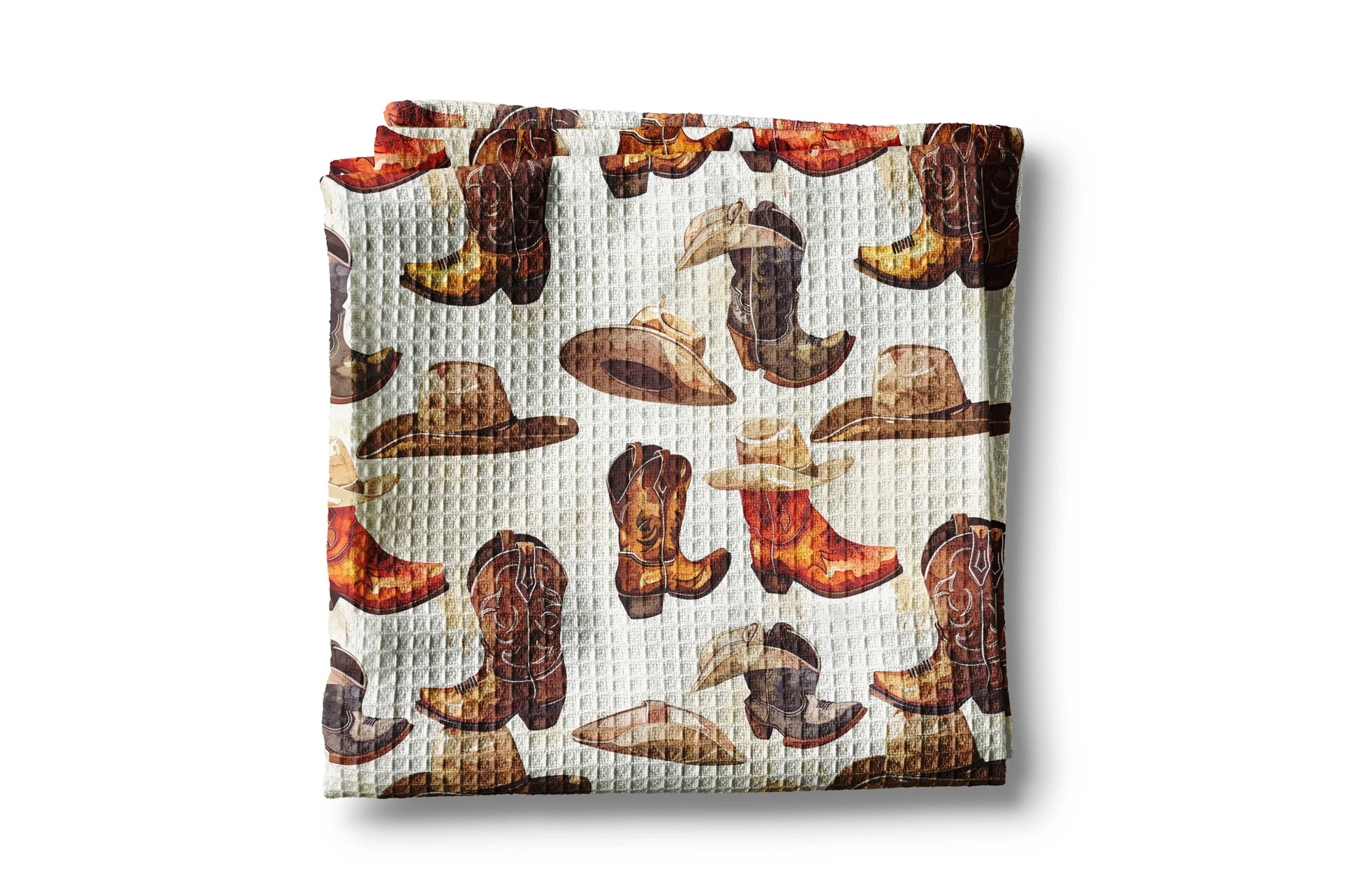 Waffle texture blanket with cowboy boot and hat pattern on a white background