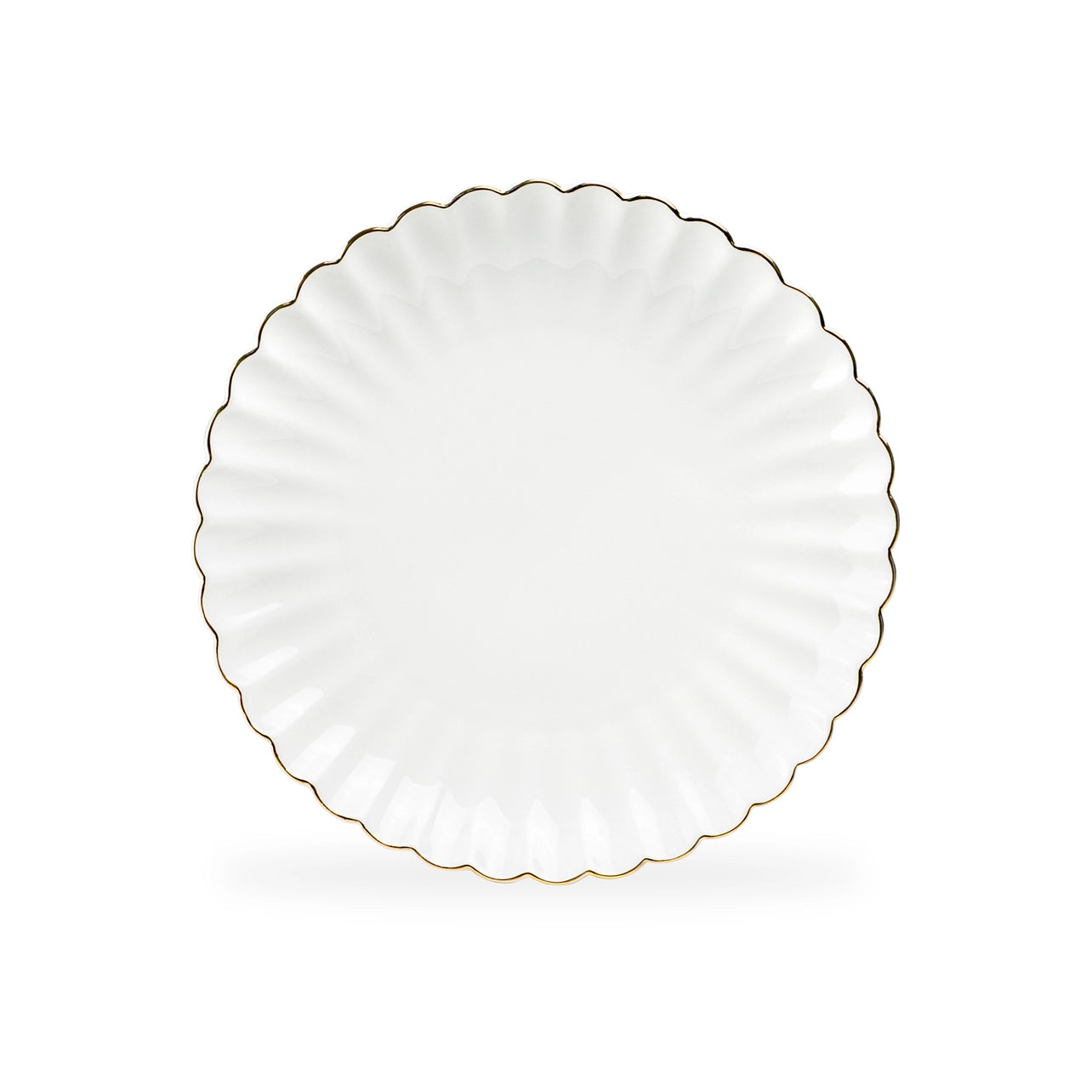 White plate with scalloped edge and gold trim on a white background