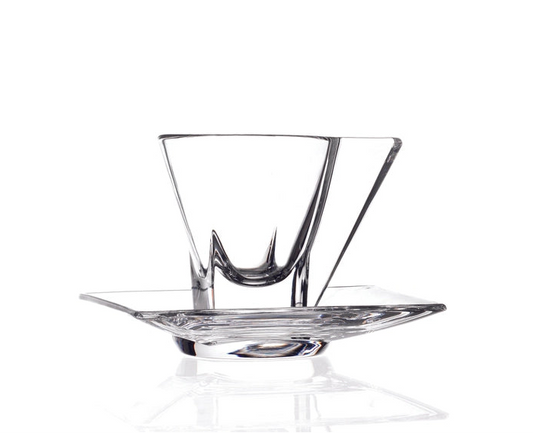 Clear glass bowl with a decorative base on a white background