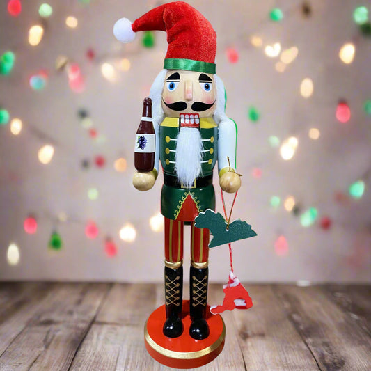 Decorative nutcracker figure with a red hat and holding a bottle on a white background