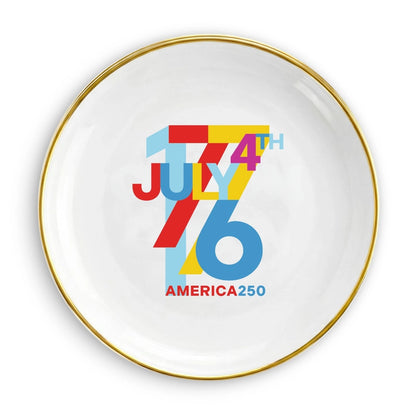 White plate with colorful 'July 4th' design on a white background