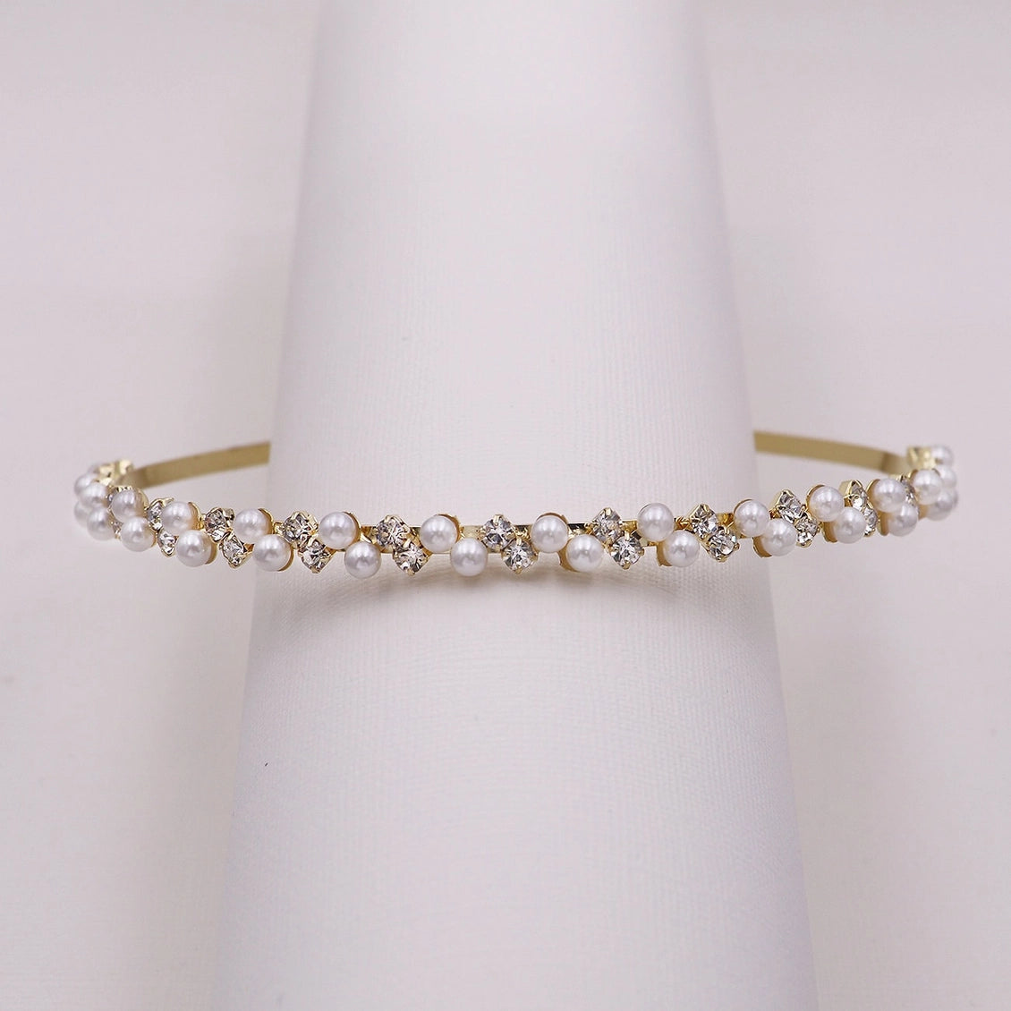 Pearl and crystal headband on a white background