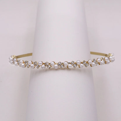 Pearl and crystal headband on a white background