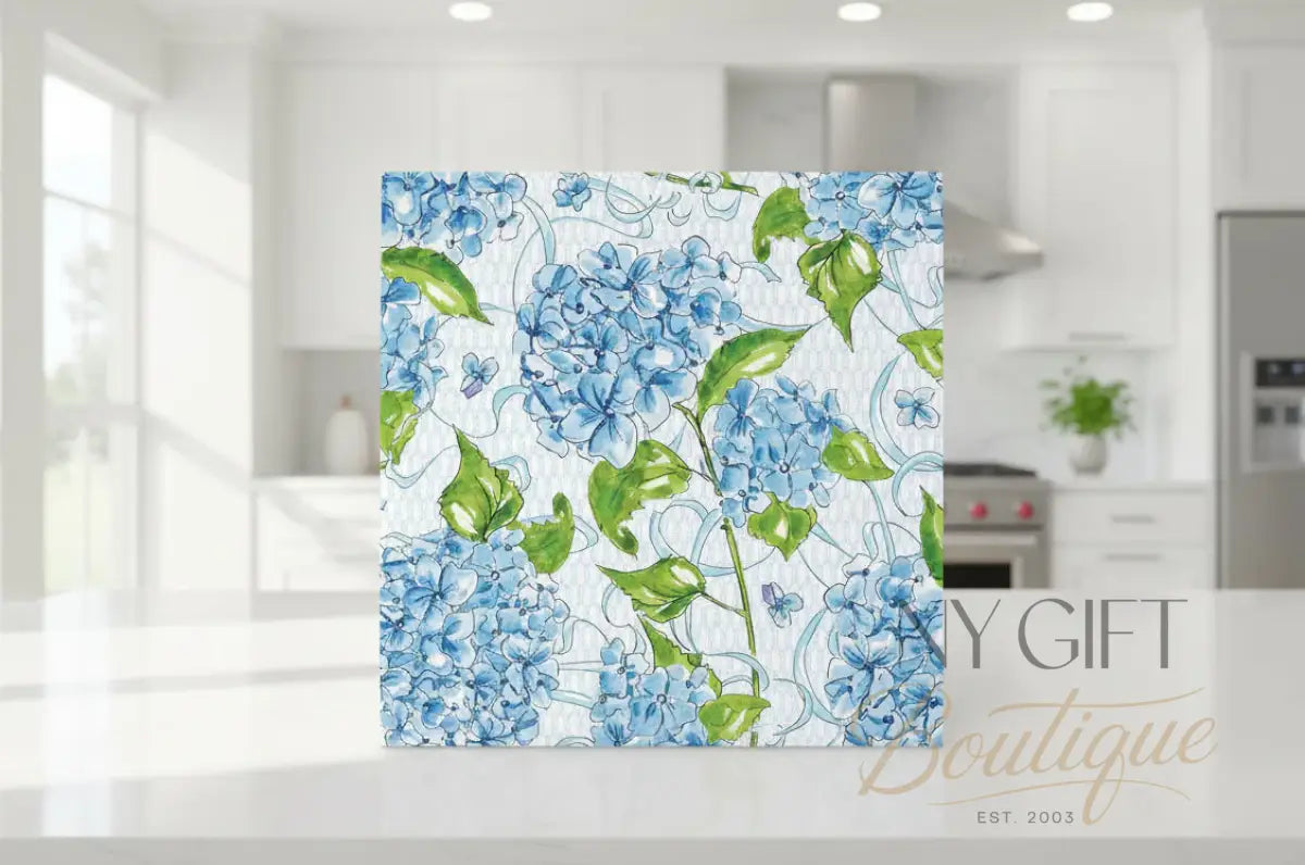 Pattern of blue flowers and green leaves on a white background