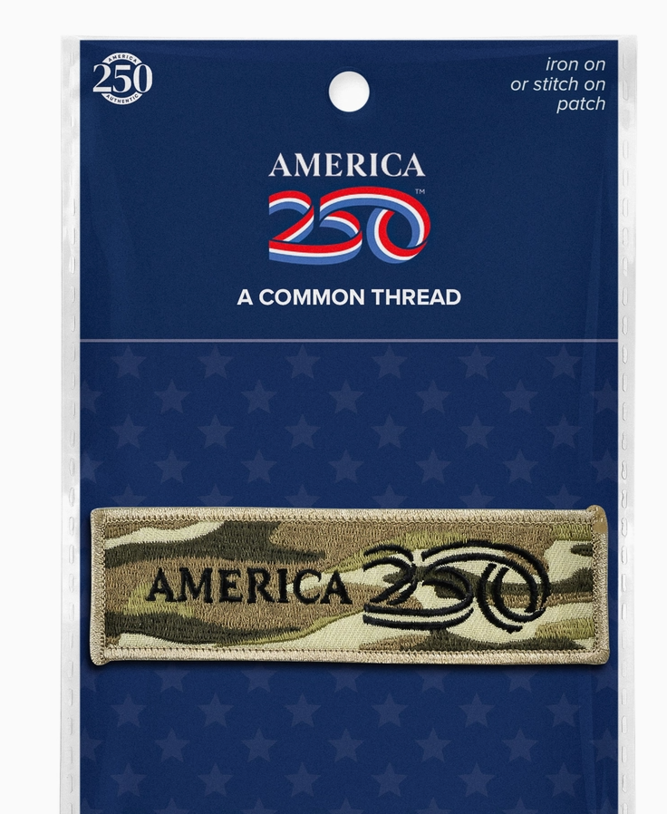 Camouflage patch with 'America 250' text on a blue card with star pattern