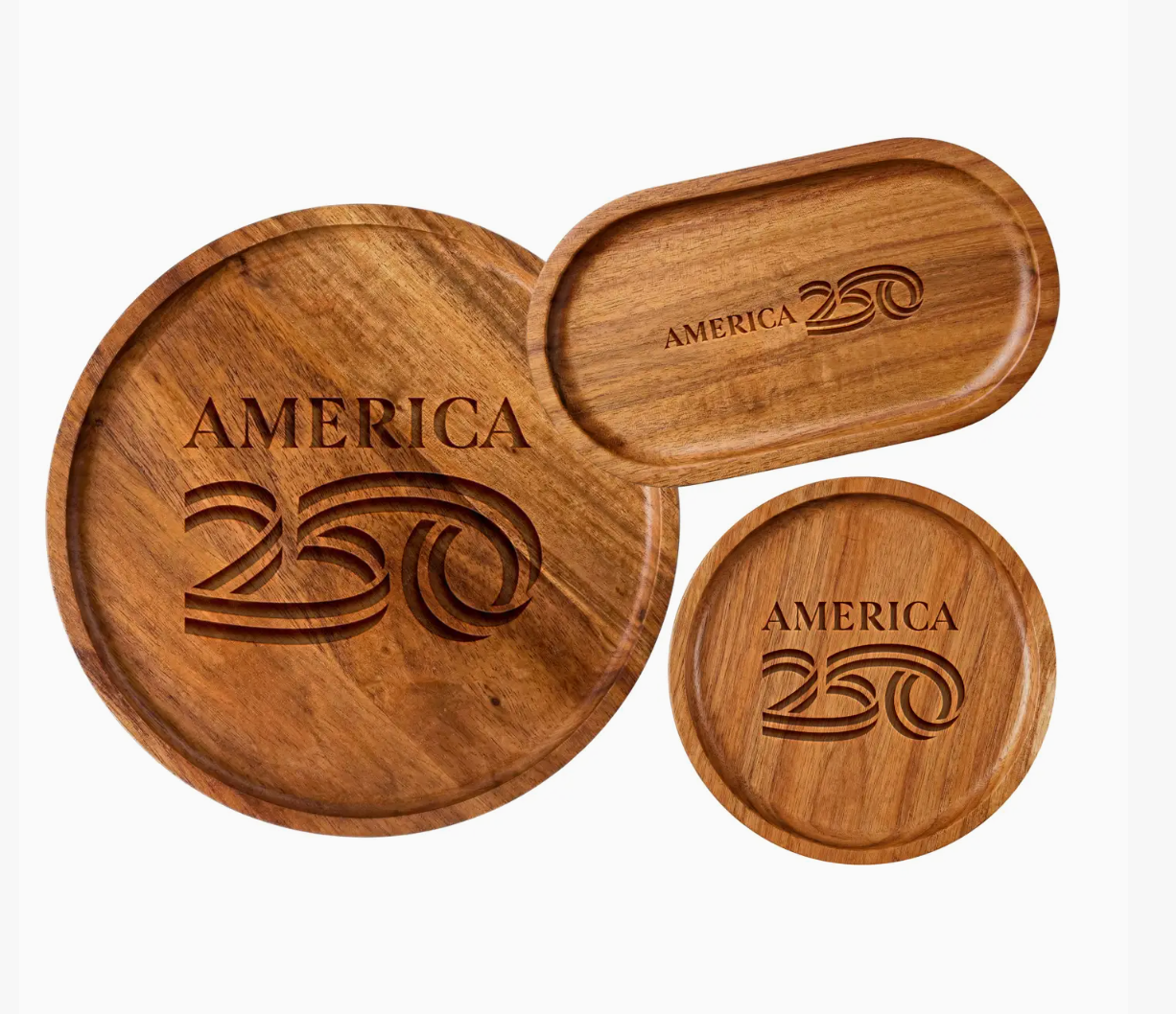 Set of wooden coasters with 'America 250' engraving on a white background