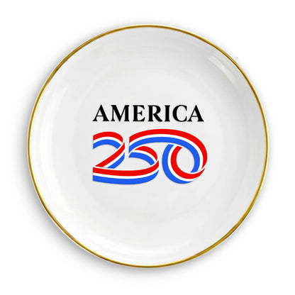 White plate with 'AMERICA 250' text and red, blue, and white design on a white background