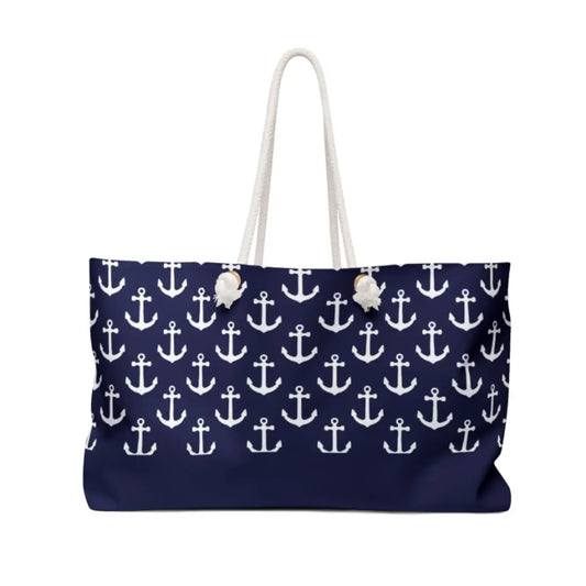 Navy blue tote bag with white anchor pattern on a white background