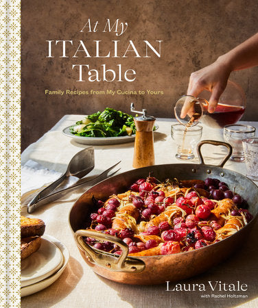 Book cover of 'At My Italian Table' with a table setting and dish of food.