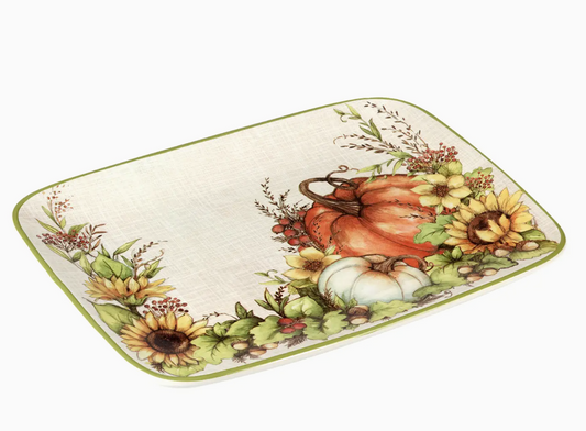 Decorative rectangular plate with autumn-themed design featuring pumpkins and sunflowers on a white background.