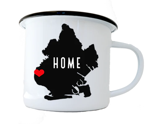 White mug with black silhouette of  Brooklyn with a red heart and the word 'HOME' on a white background