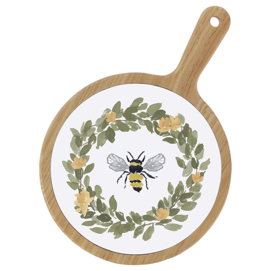 Round wooden cutting board with a bee and floral design on a white background