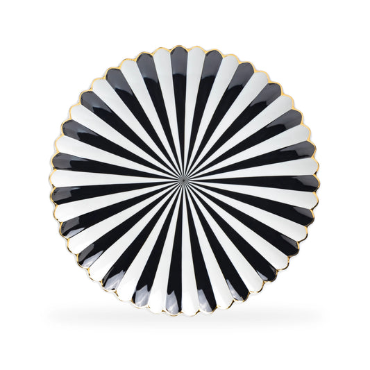 Decorative plate with black and white striped pattern on a white background