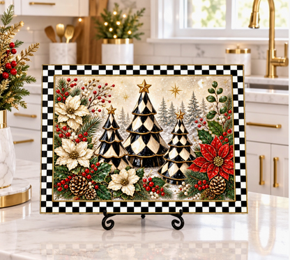 Black and white checker Christmas tree glass cutting board with poinsettias, berries, greenery and gold accents displayed in a holiday kitchen