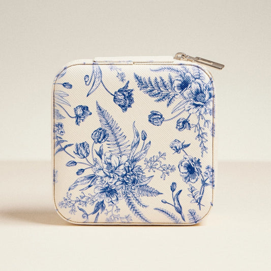 Floral patterned case with a zipper on a beige background
