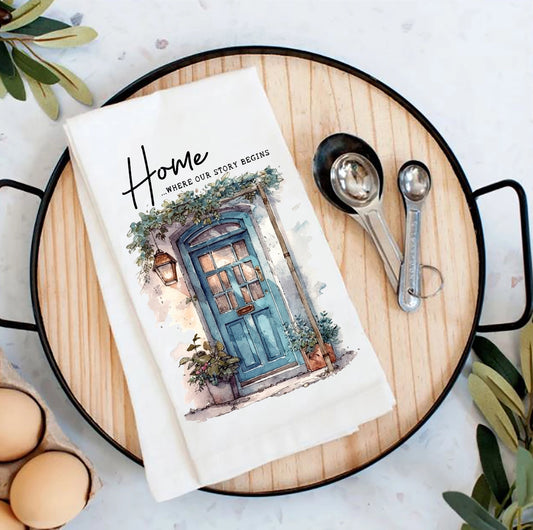 Tea towel with a door design on a wooden board with measuring spoons and eggs.