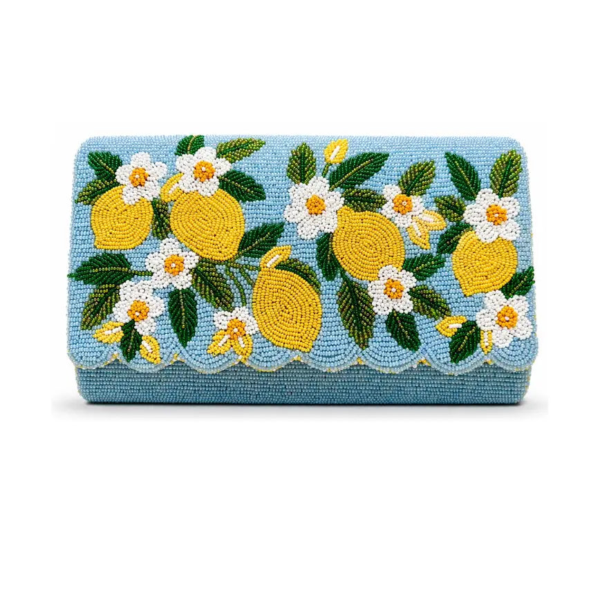 A rectangular blue beaded clutch purse featuring a detailed lemon and white flower pattern on the front flap, set against a plain white background. NY Gift Boutique