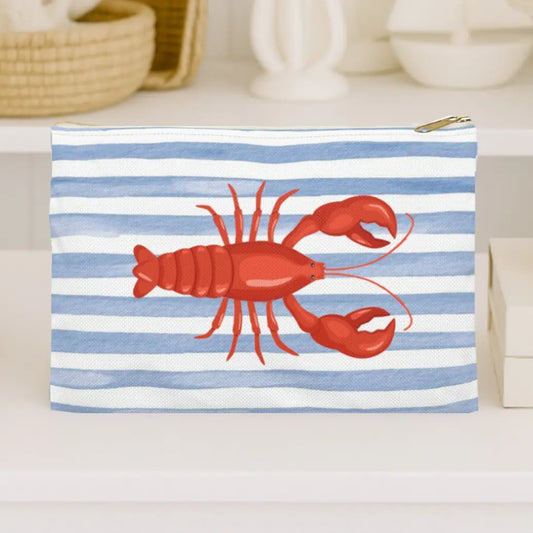 Pouch with red lobster design on blue and white striped background