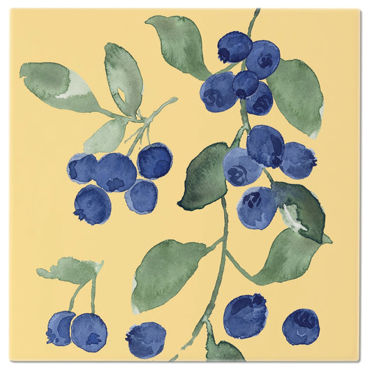 Art print of blueberries and green leaves on a yellow background